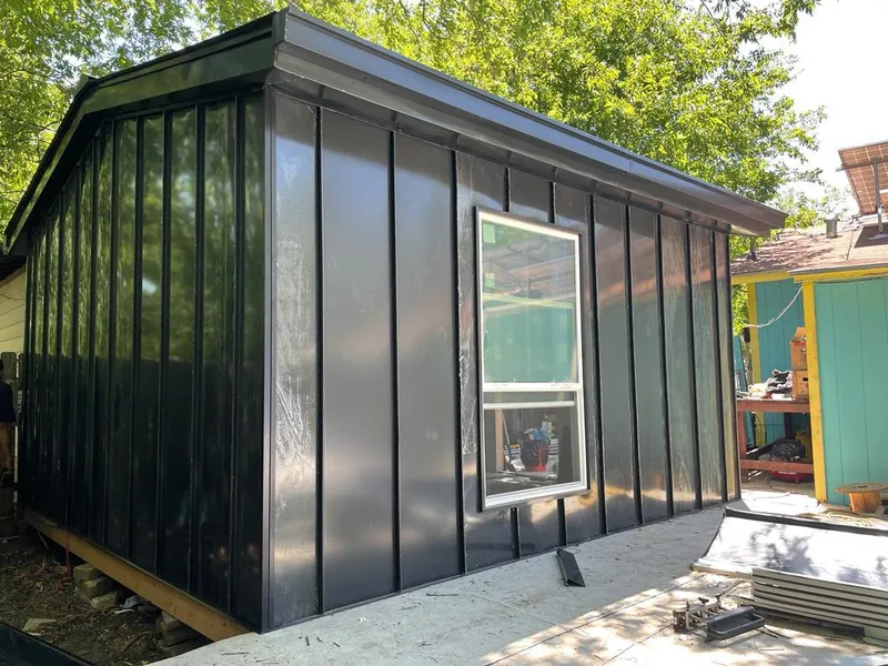 Black standing seam metal wall panels for Roof Inspection in Acton